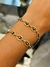 Pulsera de acero quirúrgico dorado con ojo turco negro en internet