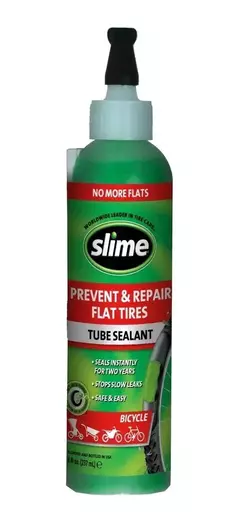 Botella de sellador de neumáticos Slime de 8 oz, diseñada para prevenir y reparar pinchazos en bicicletas.