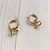 Argolla acero dorado 1,5 cm con dije corazon cruzado, mitad cubic