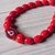 Pulsera acero con cuentas de cerámica roja y dije central de vidrio