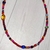 Collar multicolor, material vidrio. Cadena de alargue, tanza, argollas y cierre de acero