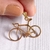 Dije acero dorado bicicleta (2 x 3 cm) en internet