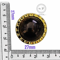 Botão para blazer ABS dourado com preto medindo 27mm, ao lado de régua para escala