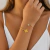 Bracelete Feminino Trevo com Strass Dourado em Aço Inoxidável BRA206 - comprar online