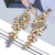 Imagem do Brincos elegantes de metal para mulheres, corrente oca, folhas de cristal, jóia