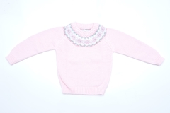 Sweater de lana rosa con guarda blanca