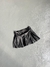 SHORT POLLERA ECO CUERO TABLEADA CON CINTO - comprar online