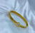 Bracelete fino com pedra em ponto de luz banhado a ouro18K
