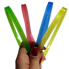 TIARA DE SILICONE INQUEBRÁVEL - DENTINHO COM GLITTER - 12 UNIDADES SORTIDAS