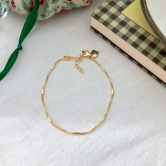 Pulseira palitos dispersos liso banhado a ouro