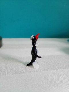 Delicado pinguim estilo murano na internet