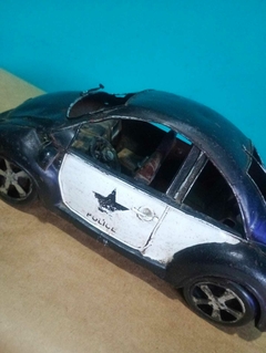 Antiga miniatura Fusca da polícia americana na internet