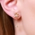 Brinco com flor e ponto de zircônia com corrente, piercing fake e coração cravejado - comprar online