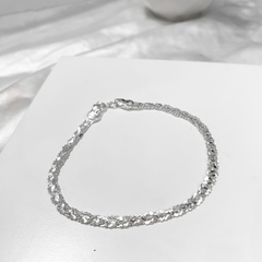 Pulseira trançada brilhante