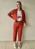 CALÇA PU COM BOTÕES E BOLSOS