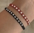 Pulseras acero blanco roja y negra