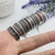 Anillo grande dibujos negros - Marilyn Acero Quirurgico