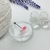Piercing lengua pastilla rosa y blanca - comprar online