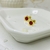 Abridor dorado florcita strass rojo