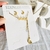 Conjunto dorado aros+ gargantilla luna y estrella - comprar online