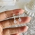 Argollas acero blanco strass y gota en internet