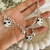 Pulsera acero blanco gota negra con flores - comprar online