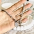 Pulsera torneada con dijes hamsa y corazon - comprar online