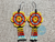 Aretes Para Mujer En Mostacilla Checa Flor Huichol Boho Amarillo y Rojo Flecos - comprar online