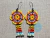 Aretes Para Mujer En Mostacilla Checa Flor Huichol Boho Amarillo y Rojo Flecos - comprar online