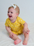 Imagem do CONJUNTO DE BEBÊ BODY MANGA CURTA BE KIND AMARELO + SHORTS LISO