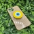 Capa com brilho + suporte olho grego iPhone 13 na internet