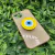 Capa com brilho + suporte olho grego iPhone 13 na internet