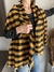 Ruana cuadritos naranja con negro - comprar online