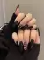 Unhas postiças decoradas cobrinha e fogo preto