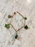 Pulsera con dijes de colores en acero dorado y vidrio en internet