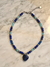 Collar de piedras de vidrio con dije