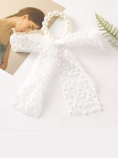 Colita con moño perlas