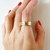 ANEL LARGO COM ZIRCÔNIA FOLHEADO A OURO 740115