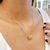 COLAR CILINDRO COM ZIRCONIAS FOLHEADO A OURO 739885 - comprar online