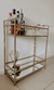 Minibar dorado con espejos en internet