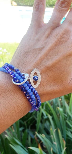 Imagen de Trio pulsera cristal de roca con dije ojo turco