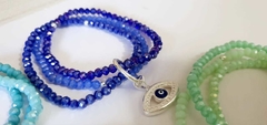 Trio pulsera cristal de roca con dije ojo turco en internet