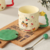 TAZA CERAMICA CON TAPA + CUCHARA MERRY CHRITSMAS 380ML - comprar online