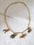 Colar Dourado com Pingente Animais Africanos - comprar online