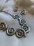 Conjunto de colar e brinco Espiral