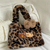 Bolsa de pelúcia Hello Kitty oncinha