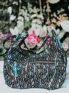 Imagen de CARTERA DE CUERO IMPORTADO TORNASOLADO COMBINADA CON CHAROL CELESTE. "ABY".