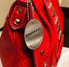 CARTERA MAI, realizada con tachas y distintos cueros en relieve. - tienda online