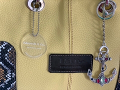 Cartera de CUERO DE SERPIENTE ITALIANA COMBINADA CON CUERO CABRITILLA LISA.