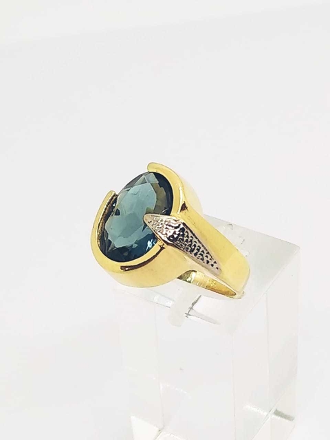 Anillo laminado en oro 18k, piedra cristal Zafiro.